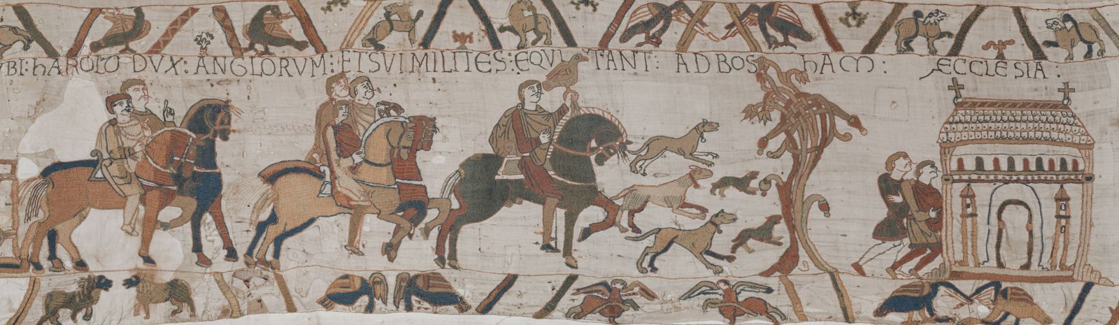 A closeup of a panel from the Bayeux Tapestry, with a Medieval man on a horse surrounded by dogs.