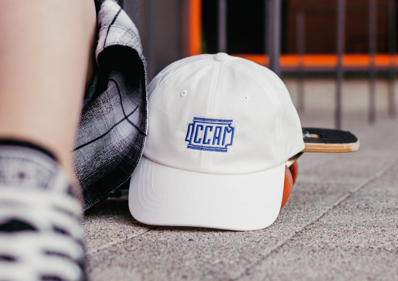 Occam's razor explained: white cap with embroidered OCCAM razor blade design