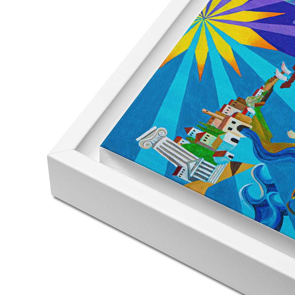 A framed colorful art print shown at an angle on a white background. The artwork features a stylized sunburst in yellow and purple rays over a blue landscape with white buildings and green hills.